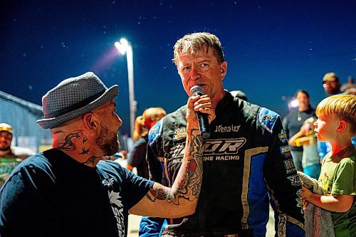 NIC ADAM / FREE PRESS
Midwest modified winner Rick Delaine gives his trophy to a young spectator at Thursday night thunder at Victory Lanes Speedway. 
240822 - Thursday, August 22, 2024.

Reporter: ?