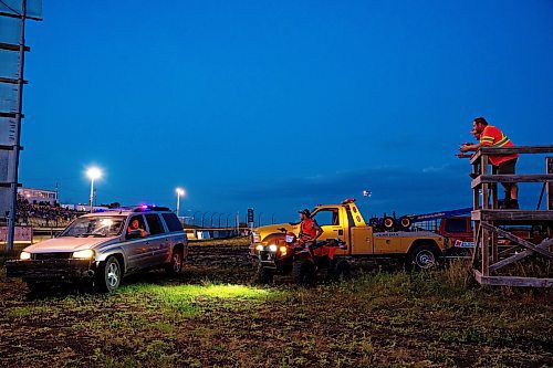 NIC ADAM / FREE PRESS
Gerald Blair (centre) and the other tow operators wait during intermission at Thursday night thunder at Victory Lanes Speedway. 
240822 - Thursday, August 22, 2024.

Reporter: ?