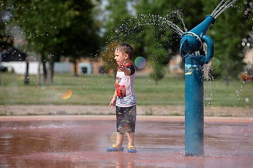 23082024
Three-year-old Bodie Graham plays at the Kin Spray Park on a hot Friday afternoon.  (Tim Smith/The Brandon Sun)