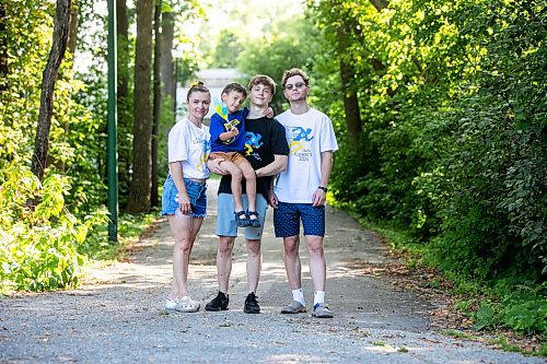 MIKAELA MACKENZIE / WINNIPEG FREE PRESS
	
Olesia (left), Danylo (six), Bohdan (17), and Nazariy Chychkevych on Friday, Aug. 23, 2024. A fundraising run for military supplies in Ukraine is being held on Saturday. Nazariy Chychkevych, a Ukrainian newcomer, is one of the organizers. 

For Matt story.
Winnipeg Free Press 2024