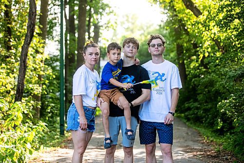 MIKAELA MACKENZIE / WINNIPEG FREE PRESS
	
Olesia (left), Danylo (six), Bohdan (17), and Nazariy Chychkevych on Friday, Aug. 23, 2024. A fundraising run for military supplies in Ukraine is being held on Saturday. Nazariy Chychkevych, a Ukrainian newcomer, is one of the organizers. 

For Matt story.
Winnipeg Free Press 2024