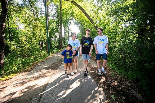 MIKAELA MACKENZIE / WINNIPEG FREE PRESS
	
Danylo (six, left), Olesia, Bohdan (17), and Nazariy Chychkevych on Friday, Aug. 23, 2024. A fundraising run for military supplies in Ukraine is being held on Saturday. Nazariy Chychkevych, a Ukrainian newcomer, is one of the organizers. 

For Matt story.
Winnipeg Free Press 2024