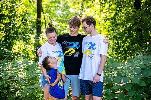 MIKAELA MACKENZIE / WINNIPEG FREE PRESS
	
Danylo (six, bottom), Olesia (top left), Bohdan (17), and Nazariy Chychkevych on Friday, Aug. 23, 2024. A fundraising run for military supplies in Ukraine is being held on Saturday. Nazariy Chychkevych, a Ukrainian newcomer, is one of the organizers. 

For Matt story.
Winnipeg Free Press 2024