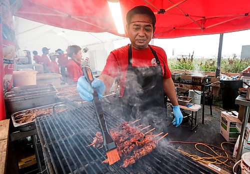 JOHN WOODS / FREE PRESS
Chef Brian Castor cooks up some Chicken BBQ during the Manitoba Filipino Street Festival in Winnipeg Sunday, August 25, 2024. 

Reporter: tyler