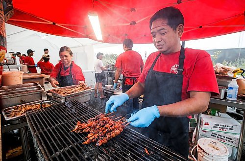 JOHN WOODS / FREE PRESS
Chef Brian Castor cooks up some Chicken BBQ during the Manitoba Filipino Street Festival in Winnipeg Sunday, August 25, 2024. 

Reporter: tyler