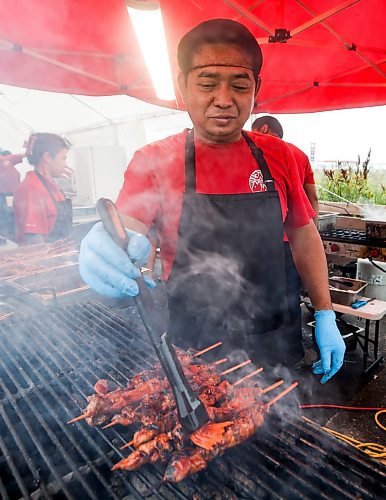 JOHN WOODS / FREE PRESS
Chef Brian Castor cooks up some Chicken BBQ during the Manitoba Filipino Street Festival in Winnipeg Sunday, August 25, 2024. 

Reporter: tyler