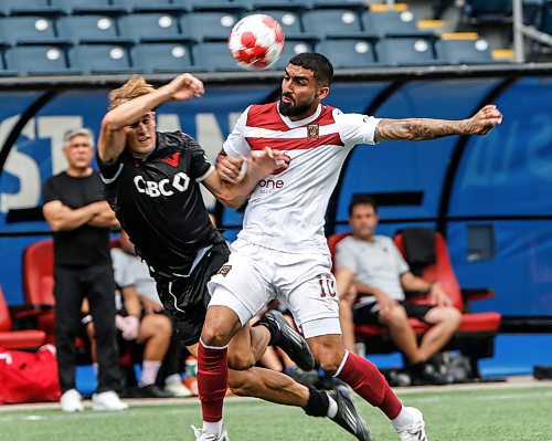 JOHN WOODS / WINNIPEG FREE PRESS
Vancouver FC&#x2019;s James Cameron (25) defends against Valour FC&#x2019;s Shaan Hundal (10) during first half Canadian Premier League action in Winnipeg Sunday, August 25, 2024. 
Reporter: ?