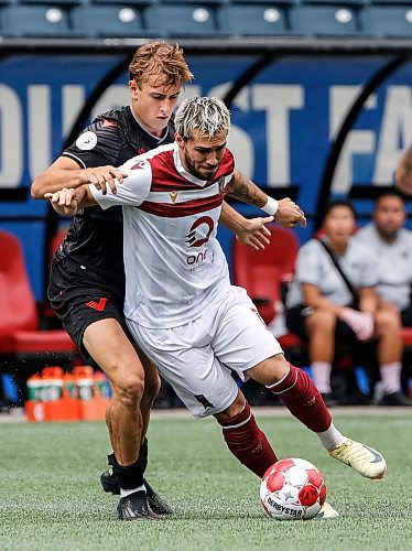 JOHN WOODS / WINNIPEG FREE PRESS
Vancouver FC&#x2019;s James Cameron (25) defends against Valour FC&#x2019;s Jordan Faria (17) during first half Canadian Premier League action in Winnipeg Sunday, August 25, 2024. 
Reporter: ?