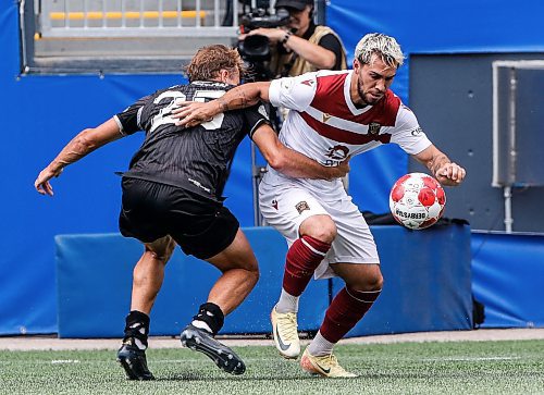 JOHN WOODS / WINNIPEG FREE PRESS
Vancouver FC&#x2019;s James Cameron (25) defends and fouls Valour FC&#x2019;s Jordan Faria (17) during first half Canadian Premier League action in Winnipeg Sunday, August 25, 2024. 
Reporter: ?