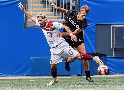 JOHN WOODS / WINNIPEG FREE PRESS
Vancouver FC&#x2019;s James Cameron (25) defends and fouls Valour FC&#x2019;s Jordan Faria (17) during first half Canadian Premier League action in Winnipeg Sunday, August 25, 2024. 
Reporter: ?