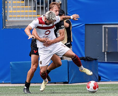 JOHN WOODS / WINNIPEG FREE PRESS
Vancouver FC&#x2019;s James Cameron (25) defends and fouls Valour FC&#x2019;s Jordan Faria (17) during first half Canadian Premier League action in Winnipeg Sunday, August 25, 2024. 
Reporter: ?