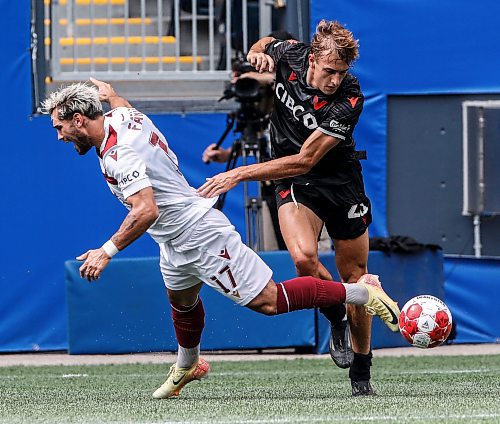 JOHN WOODS / WINNIPEG FREE PRESS
Vancouver FC&#x2019;s James Cameron (25) defends and fouls Valour FC&#x2019;s Jordan Faria (17) during first half Canadian Premier League action in Winnipeg Sunday, August 25, 2024. 
Reporter: ?