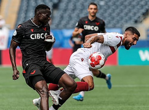 JOHN WOODS / WINNIPEG FREE PRESS
Vancouver FC&#x2019;s Allan Enyou (4) defends against Valour FC&#x2019;s Shaan Hundal (10) during first half Canadian Premier League action in Winnipeg Sunday, August 25, 2024. 
Reporter: ?