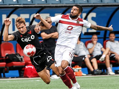 JOHN WOODS / WINNIPEG FREE PRESS
Vancouver FC&#x2019;s James Cameron (25) defends against Valour FC&#x2019;s Shaan Hundal (10) during first half Canadian Premier League action in Winnipeg Sunday, August 25, 2024. 
Reporter: ?