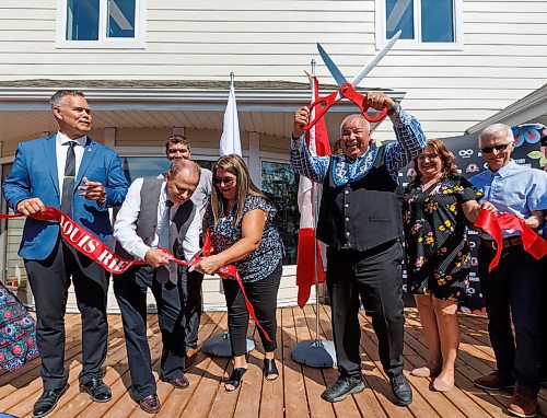 MIKE DEAL / FREE PRESS
(From left); Robert Loiselle MLA for St. Boniface, Parliamentary Secretary to the Leader of the Government in the House of Commons and Member of Parliament- Winnipeg North, Kevin Lamoureux, MMF’s Early Learning and Child Care Department Minister Frances Chartrand, Manitoba Métis Federation President David Chartrand brandishing giant scissors, Infinity Women Secretariat spokeswoman Anita Campbell, and Provincial Minister of Education and Early Childhood Learning Nello Altomare, during the ribbon cutting at the grand opening of the Louis Riel Child Care Centre at 561 Rue St. Jean Baptiste.
The MMF opened its eighth child care facility in Winnipeg since 2019. 
The facility adds 40 spaces for infant and preschool children to the Winnipeg area, while providing quality, culturally focused programming for young Red River Métis Citizens, creating employment and allowing parents to get back to their workplaces.
See Malak Abas story
240826 - Monday, August 26, 2024.