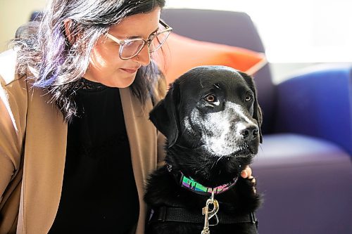 MIKAELA MACKENZIE / WINNIPEG FREE PRESS
	
Victim services worker Carla Deeley with victim services support dog Gloucester (aka Glossy) on Monday, Aug. 26, 2024. 

For Nicole story.
Winnipeg Free Press 2024