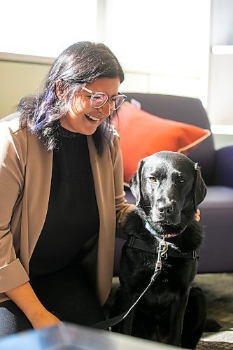 MIKAELA MACKENZIE / WINNIPEG FREE PRESS
	
Victim services worker Carla Deeley with victim services support dog Gloucester (aka Glossy) on Monday, Aug. 26, 2024. 

For Nicole story.
Winnipeg Free Press 2024