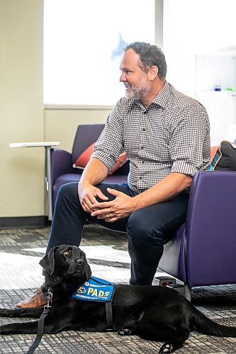 MIKAELA MACKENZIE / WINNIPEG FREE PRESS
	
Justice minister Matt Wiebe and victim services support dog Gloucester (aka Glossy) on Monday, Aug. 26, 2024. 

For Nicole story.
Winnipeg Free Press 2024