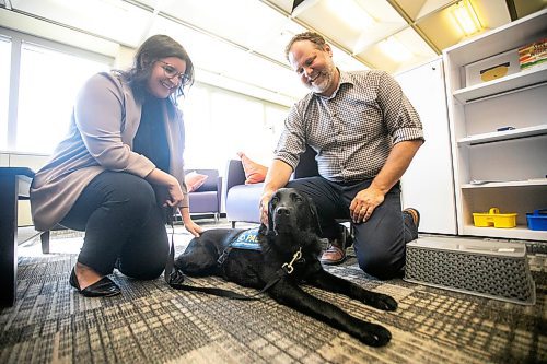 MIKAELA MACKENZIE / WINNIPEG FREE PRESS
	
Justice minister Matt Wiebe, victim services worker Carla Deeley, and victim services support dog Gloucester (aka Glossy) on Monday, Aug. 26, 2024. 

For Nicole story.
Winnipeg Free Press 2024