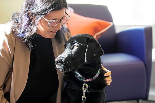 MIKAELA MACKENZIE / WINNIPEG FREE PRESS
	
Victim services worker Carla Deeley with victim services support dog Gloucester (aka Glossy) on Monday, Aug. 26, 2024. 

For Nicole story.
Winnipeg Free Press 2024