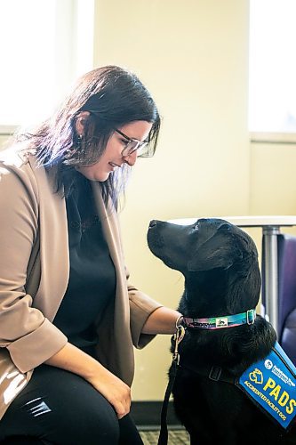 MIKAELA MACKENZIE / WINNIPEG FREE PRESS
	
Victim services worker Carla Deeley with victim services support dog Gloucester (aka Glossy) on Monday, Aug. 26, 2024. 

For Nicole story.
Winnipeg Free Press 2024