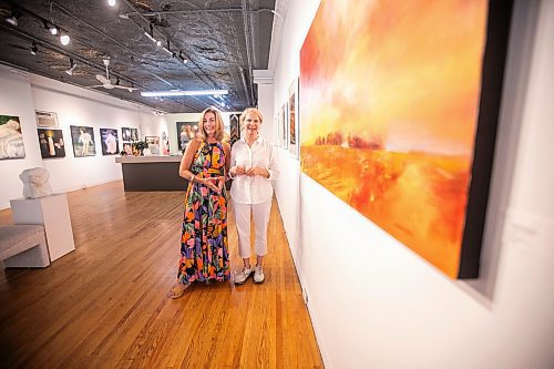 MIKAELA MACKENZIE / WINNIPEG FREE PRESS
	
Gallery owner Julie Walsh (left) and artist Bette Woodland at the &#x48c;OOK CLOSER&#x4e0;exhibit at Soul Gallery Inc. on Friday, Aug. 23, 2024. 

For arts story.
Winnipeg Free Press 2024