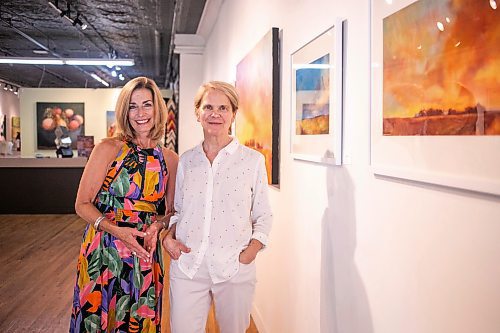 MIKAELA MACKENZIE / WINNIPEG FREE PRESS
	
Gallery owner Julie Walsh (left) and artist Bette Woodland at the &#x48c;OOK CLOSER&#x4e0;exhibit at Soul Gallery Inc. on Friday, Aug. 23, 2024. 

For arts story.
Winnipeg Free Press 2024