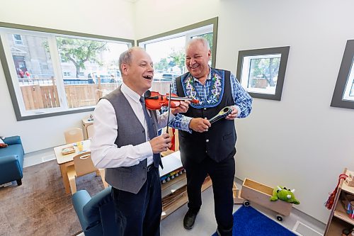 MIKE DEAL / FREE PRESS
Parliamentary Secretary to the Leader of the Government in the House of Commons and Member of Parliament- Winnipeg North, Kevin Lamoureux and Manitoba M&#xe9;tis Federation President David Chartrand attempt to play a tune using child sized instruments during the grand opening of the Louis Riel Child Care Centre at 561 Rue St. Jean Baptiste.
The MMF opened its eighth child care facility in Winnipeg since 2019. 
The facility adds 40 spaces for infant and preschool children to the Winnipeg area, while providing quality, culturally focused programming for young Red River M&#xe9;tis Citizens, creating employment and allowing parents to get back to their workplaces.
See Malak Abas story
240826 - Monday, August 26, 2024.