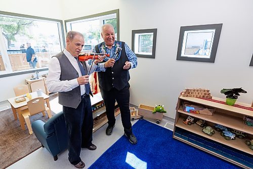 MIKE DEAL / FREE PRESS
Parliamentary Secretary to the Leader of the Government in the House of Commons and Member of Parliament- Winnipeg North, Kevin Lamoureux and Manitoba M&#xe9;tis Federation President David Chartrand attempt to play a tune using child sized instruments during the grand opening of the Louis Riel Child Care Centre at 561 Rue St. Jean Baptiste.
The MMF opened its eighth child care facility in Winnipeg since 2019. 
The facility adds 40 spaces for infant and preschool children to the Winnipeg area, while providing quality, culturally focused programming for young Red River M&#xe9;tis Citizens, creating employment and allowing parents to get back to their workplaces.
See Malak Abas story
240826 - Monday, August 26, 2024.