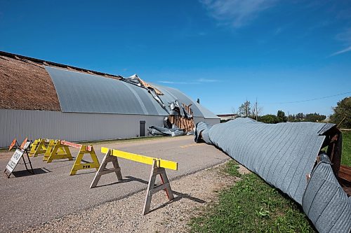 26082024
Portions of the Foxwarren District Rec. Centre roof lie strewn along the street and yards surrounding the recreation centre Monday after and early morning storm on Sunday ripped a large portion of the roof off of the building. 
(Tim Smith/The Brandon Sun)