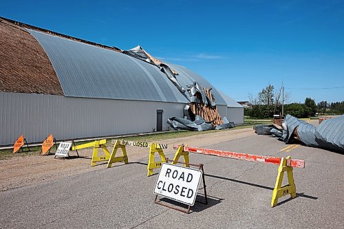 26082024
Portions of the Foxwarren District Rec. Centre roof lie strewn along the street and yards surrounding the recreation centre Monday after and early morning storm on Sunday ripped a large portion of the roof off of the building. 
(Tim Smith/The Brandon Sun)