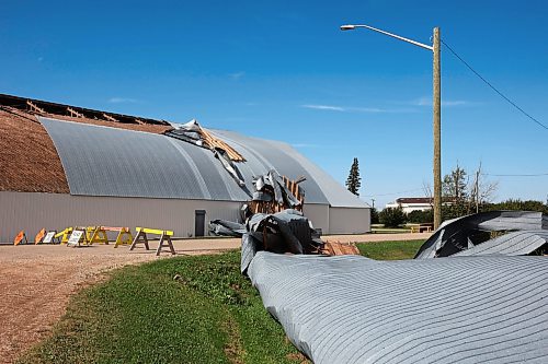 26082024
Portions of the Foxwarren District Rec. Centre roof lie strewn along the street and yards surrounding the recreation centre Monday after and early morning storm on Sunday ripped a large portion of the roof off of the building. 
(Tim Smith/The Brandon Sun)