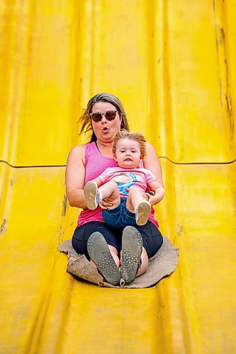 NIC ADAM / FREE PRESS
Three-year-old Madeline Cote, and her mom Julie, have fun on the Super Slide  at Tinker Town Monday afternoon.
240826 - Monday, August 26, 2024.

Reporter: ?