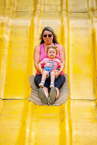 NIC ADAM / FREE PRESS
Three-year-old Madeline Cote, and her mom Julie, have fun on the Super Slide  at Tinker Town Monday afternoon.
240826 - Monday, August 26, 2024.

Reporter: ?