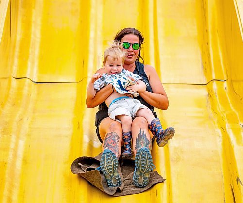 NIC ADAM / FREE PRESS
Two-and-a-half year old Caleb Campbell, and his mom Melissa, have fun on the Super Slide  at Tinker Town Monday afternoon.
240826 - Monday, August 26, 2024.

Reporter: ?