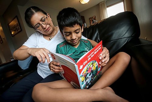 JOHN WOODS / FREE PRESS
Aline Tezcucano, who immigrated from Mexico in 2003, and her seven year old son Riley read spanish books in their home Monday, August 26, 2024. Tezcucano is teaching her son spanish.

Reporter: ?