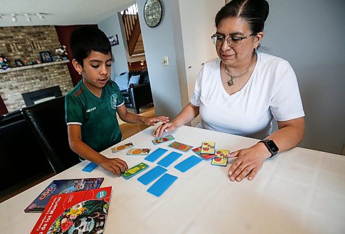 JOHN WOODS / FREE PRESS
Aline Tezcucano, who immigrated from Mexico in 2003, and her seven year old son Riley play a spanish word game in their home Monday, August 26, 2024. Tezcucano is teaching her son spanish.

Reporter: ?