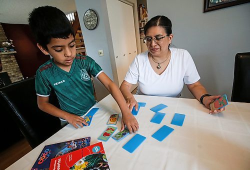 JOHN WOODS / FREE PRESS
Aline Tezcucano, who immigrated from Mexico in 2003, and her seven year old son Riley play a spanish word game in their home Monday, August 26, 2024. Tezcucano is teaching her son spanish.

Reporter: ?