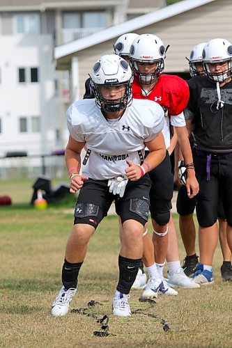 Brayden Smith leads a group of Vikings through agility drills at training camp on Monday. (Thomas Friesen/The Brandon Sun)