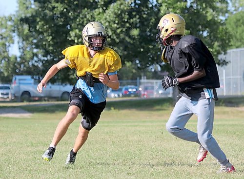 Simon Leckie, left, turns to block during a running play at Crocus Plainsmen football camp on Monday. The senior receiver says he added 15 pounds since last year and his blocking has improved as a result. (Thomas Friesen/The Brandon Sun)