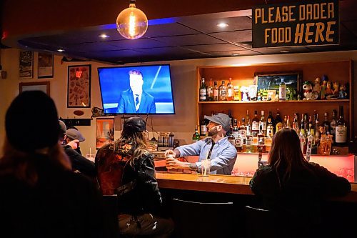 Mike Sudoma/Free Press
Co owner Jesse Kowalski pours a beer and chats with patrons while the Vancouver Canucks vs Edmonton Oilers game plays in the background at The Handsome Daughter Sunday evening
May 12, 2024