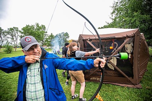 MIKAELA MACKENZIE / WINNIPEG FREE PRESS
	
Cliff Thomas (left) and Kurt Gougeon (18) try out archery at the 6th annual Manitoba Mtis Federation elders and youth gathering at Selkirk Park on Tuesday, Aug. 27, 2024. The gathering brings together elders and youth from across the regions so that the youth can learn traditional skills, hear oral teachings and learn the principles of culturally-focused interactions with knowledge keepers.

Standup.
Winnipeg Free Press 2024