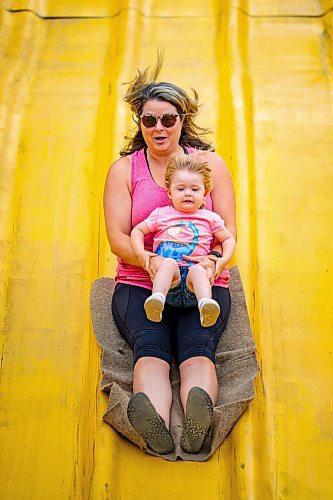 NIC ADAM / FREE PRESS
Three-year-old Madeline Cote, and her mom Julie, have fun on the Super Slide  at Tinker Town Monday afternoon.
240826 - Monday, August 26, 2024.

Reporter: ?