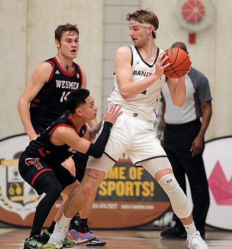 JASON HALSTEAD / WINNIPEG FREE PRESS

University of Winnipeg Wesmen guard Shawn Maranan defends against University of Manitoba Bisons forward Simon Hildebrandt during Canada West university basketball action on Feb. 3, 2023, at Investors Group Athletic Centre at the University of Manitoba.