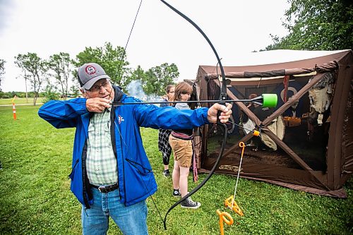 MIKAELA MACKENZIE / WINNIPEG FREE PRESS
	
Cliff Thomas (left) and Kurt Gougeon (18) try out archery at the 6th annual Manitoba Mtis Federation elders and youth gathering at Selkirk Park on Tuesday, Aug. 27, 2024. The gathering brings together elders and youth from across the regions so that the youth can learn traditional skills, hear oral teachings and learn the principles of culturally-focused interactions with knowledge keepers.

Standup.
Winnipeg Free Press 2024