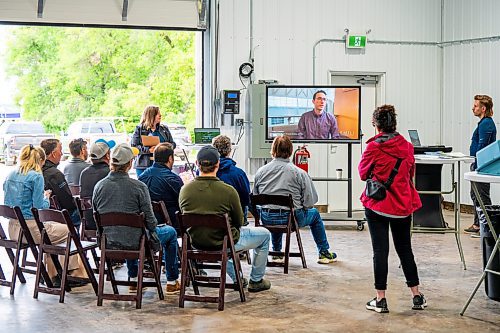 NIC ADAM / FREE PRESS
Emili communication manager Jennifer Cox (standing, left) and public policy &amp; stakeholder engagement manager Kyle Hiebert gives a presentation at Innovation Farms Tuesday.
240826 - Monday, August 26, 2024.

Reporter: Gabby