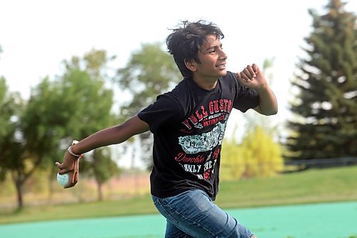 27082024
Niv Patel bowls the ball while playing cricket with friends at Crocus Plains Regional Secondary School on Tuesday.
(Tim Smith/The Brandon Sun)