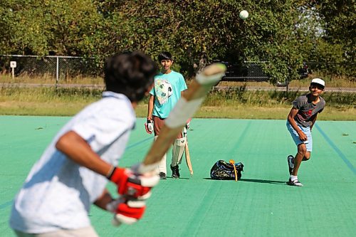 27082024
Devarsh Patel bowls the ball for Dax Patel at bat as Dev Panjabi watches while a group of friends play cricket at Crocus Plains Regional Secondary School on Tuesday.
(Tim Smith/The Brandon Sun)