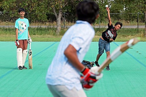 27082024
Niv Patel bowls the ball for Dax Patel at bat as Dev Panjabi watches while a group of friends play cricket at Crocus Plains Regional Secondary School on Tuesday.
(Tim Smith/The Brandon Sun)