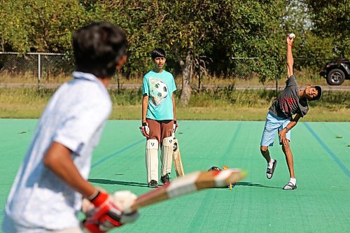 27082024
Devarsh Patel bowls the ball for Dax Patel at bat as Dev Panjabi watches while a group of friends play cricket at Crocus Plains Regional Secondary School on Tuesday.
(Tim Smith/The Brandon Sun)